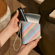 Hand holding a Ploom Duo Carry Case Multicolored Patterned Canvas accessory