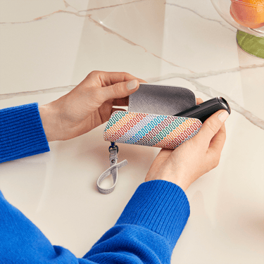Ploom Aura Multicolored Patterned Canvas Solo Carry Case accessory on a table
